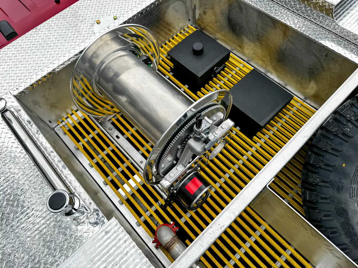 Top rear platform view showing side rails and open grating bay.